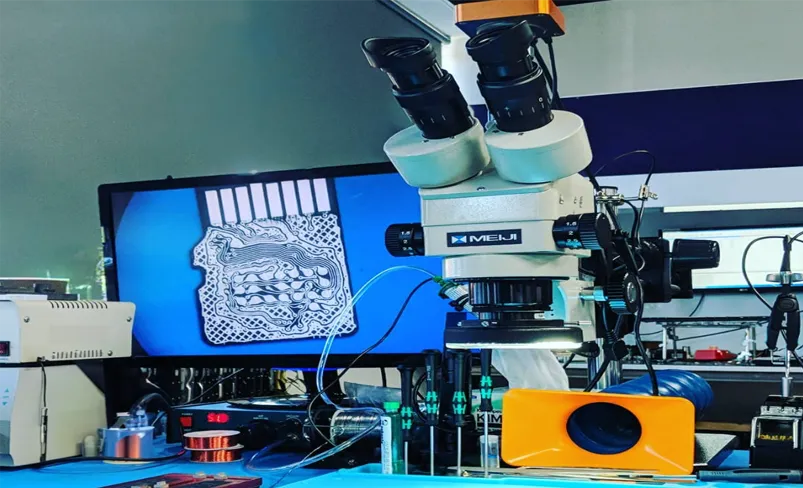 Microscopic view of a MicroSD card displayed on a computer screen for data recovery analysis.